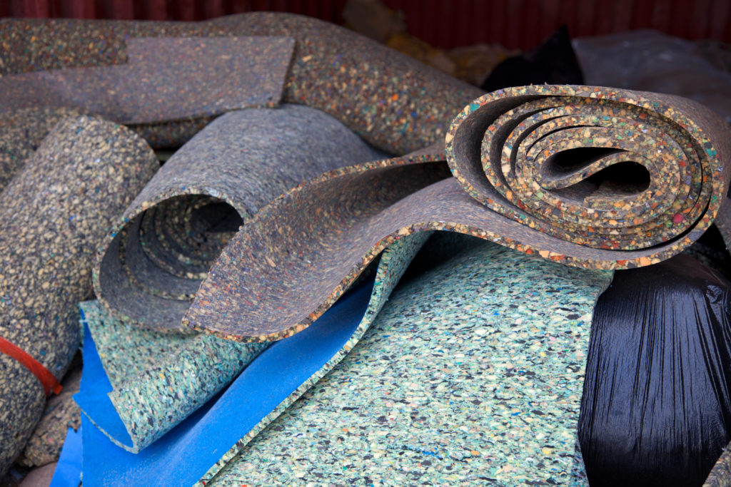 Rolls of carpet padding in a pile